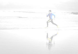Young athlete training  on the beach